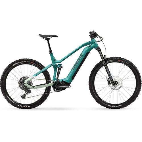 Grünes Elektro-Mountainbike mit robustem Rahmen und dicken Reifen, seitliche Ansicht.